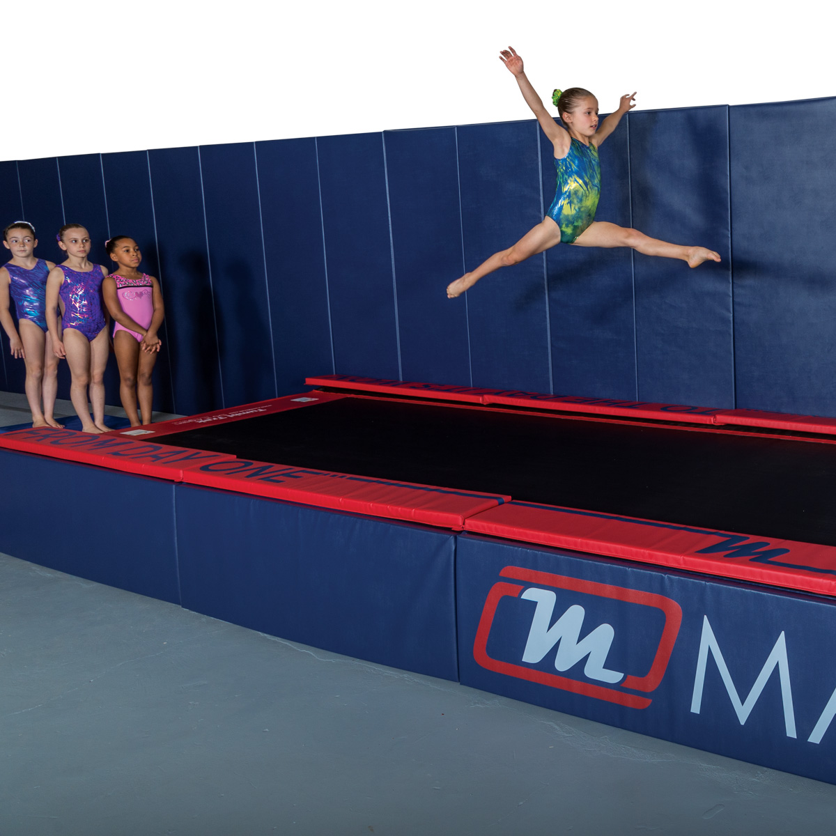 Tumbl Trak top padding with gymnasts, padded side skirt and removable wall padding mats